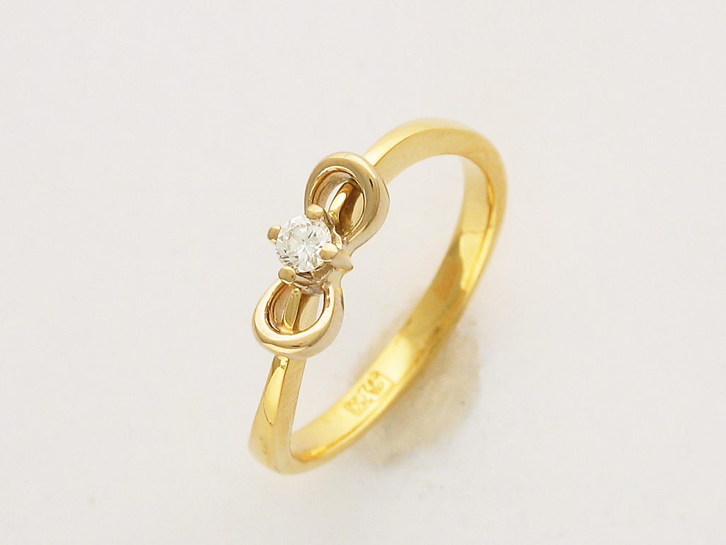Кольцо из комбинированного золота c бриллиантом 32к680527 фото